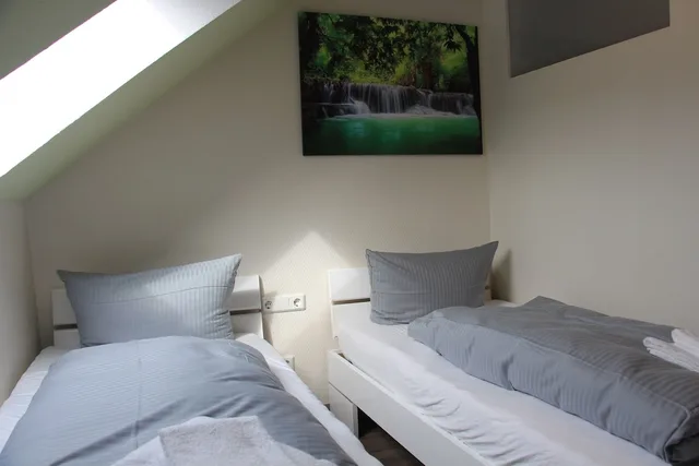 غرفة مفردة بسريرين منفصلين، REGIOHOTEL Pfalzer Hof Wernigerode 3/4