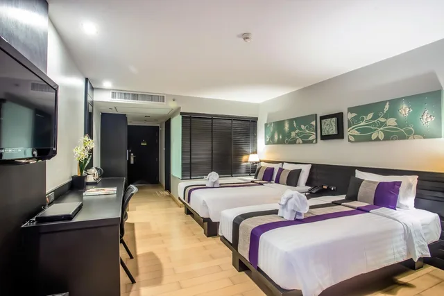 غرفة غراند ديلوكس ثلاثية بسرير مزدوج وسرير فردي، Nouvo City Hotel 6/9