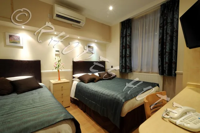 Semi Basement, Triple, 1 Double and 1 Single Bed, Small، Rhodes Hotel 1/2