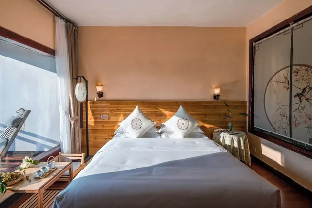 غرفة رباعية بسرير كوين وسريرين منفصلين، Snow Lion Riverside Resort 1/10