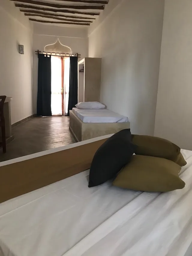 غرفة ديلوكس ثلاثية بسرير كوين وسرير فردي، Sea View Lodge Boutique Hotel 1/2