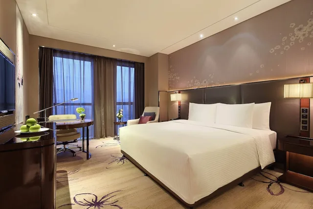 غرفة تنفيذية بسرير كينج، Wanda Realm Guangyuan 3/7