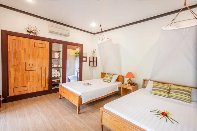 بنغل ثلاثي بسرير مزدوج وسرير فردي بإطلالة على الحديقة، Bao Quynh Bungalow 2/5