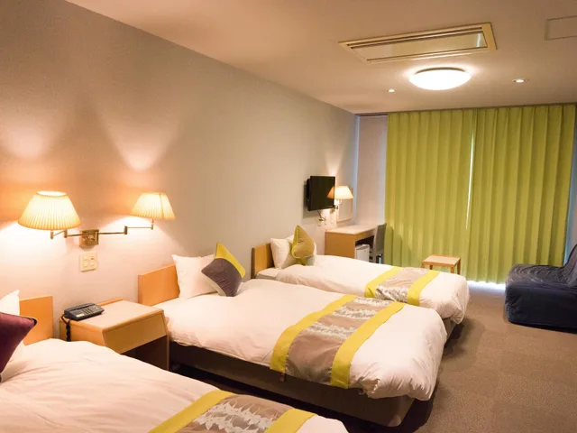 غرفة ثلاثية بثلاثة أسرّة، Hotel Caretta Amami 2/5