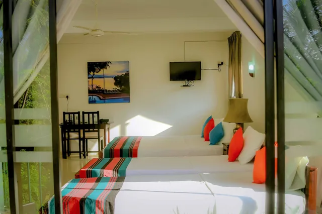 1 Bedroom, Deluxe, Triple, 1 King and 1 Single Beds, Lake View, Smoking, Oruthota Chalets 4/4