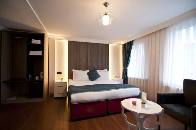 غرفة ديلوكس بسرير كوين وسرير فردي، Nar Sultan Hotel 6/10