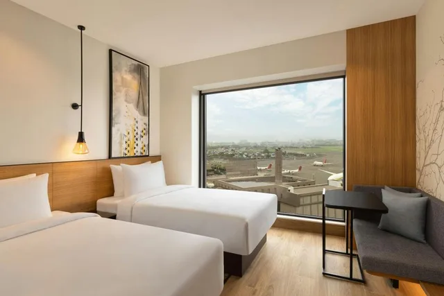 غرفة ديلوكس بسريرين منفصلين بإطلالة على الحديقة، Fairfield by Marriott Mumbai International Airport 2/4