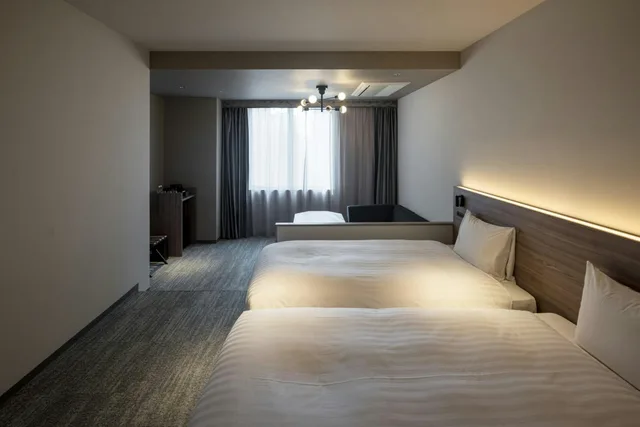 غرفة بسريرين منفصلين مع أريكة، Hotel Grand Tiara Anjo 1/1
