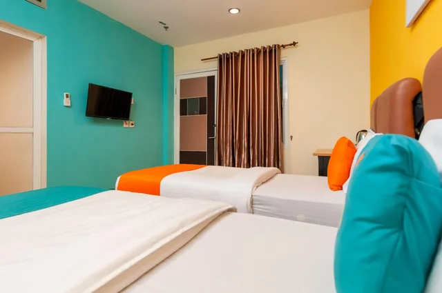 غرفة ديلوكس بسريرين منفصلين، Sans Hotel Finest Medan 3/4