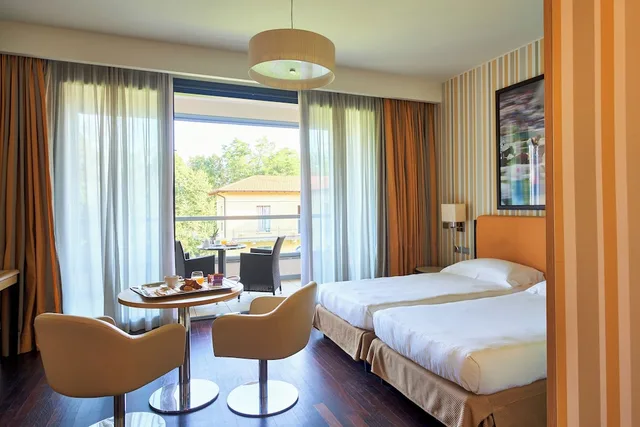 غرفة ديلوكس بسرير كوين، Unahotels Varese 2/10