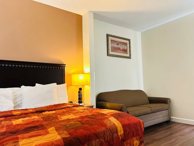 Superior, King Bed, Sofa, The Best Inn & Suites 1/1