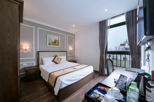 غرفة قياسية بسرير كينج وسريرين منفصلين، Louisland Hotel 1/2