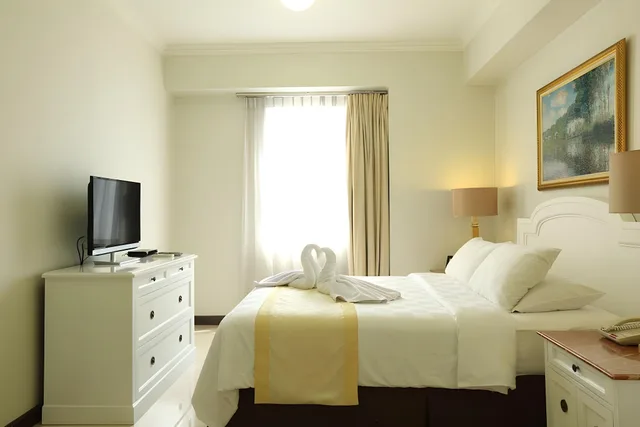 غرفة فاخرة بسرير كينج وسرير فردي بغرفتي نوم، Aryaduta Suites Semanggi 2/2
