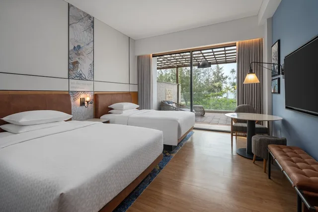 غرفة بسريرين منفصلين بإطلالة على البحر بشرفة، Four Points by Sheraton Bintan, Lagoi Bay 2/4