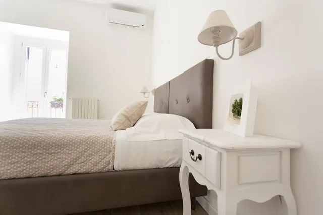 غرفة ديلوكس بسرير كوين وسرير فردي، Residence Le Vie Del Centro 1/7