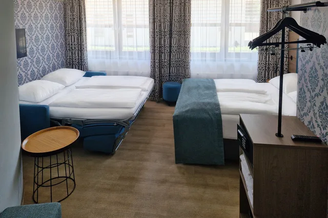 غرفة بريميوم بسرير كوين مع أريكة، Garner Hotel Hamburg Nord 3/4