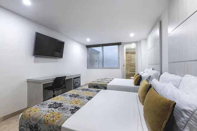 غرفة ثلاثية بسرير مزدوج وسرير فردي، Hotel Madeiro 1/10