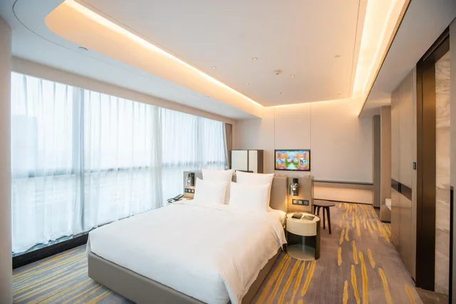 غرفة ديلوكس بسرير كينج وسرير كوين، Pullman Suzhou Zhonghui 1/5
