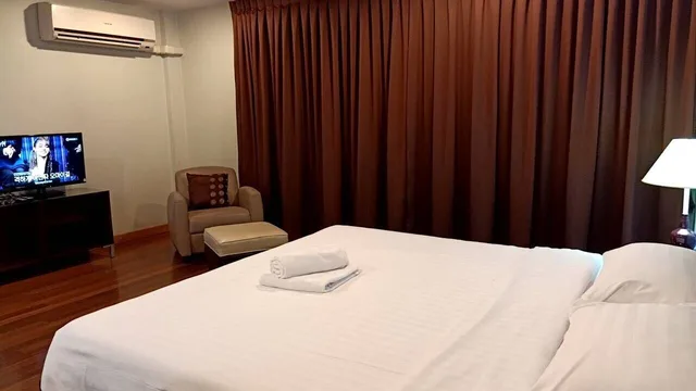 غرفة ديلوكس بسرير كينج، Mango Bedroom Inn 1/2