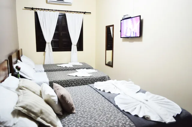 غرفة ديلوكس بسرير مزدوج وسريرين منفصلين، Pousada Canasvieiras 7/10