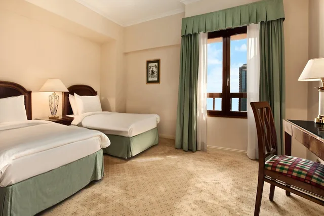 غرفة متصلة عائلية بسرير كينج وسرير فردي بإطلالة على المدينة، Cairo World Trade Center Hotel and Residences 1/2