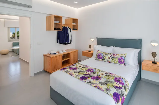 جناح ديلوكس بسرير كوين مع أريكة، Harmony Suites 6/10