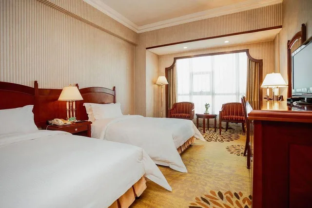 غرفة ديلوكس بسريرين منفصلين، Wuhuan Hotel 1/1