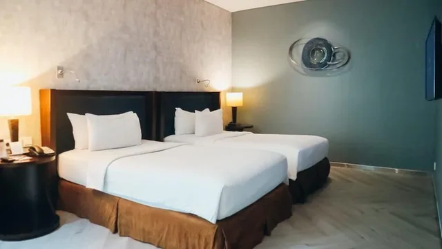 غرفة ديلوكس بسريرين منفصلين للمدخنين، Cambridge Hotel Medan (ex Grand Swiss Belhotel Medan) 1/1