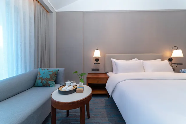 غرفة ديلوكس بسرير كينج، Yihohotel Xiang an Xiamen 2/4