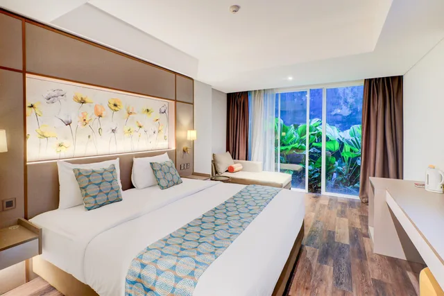 Deluxe, Double Bed, Sunday Hotel Sunset Road Near Trans Studio Mall 3/4
