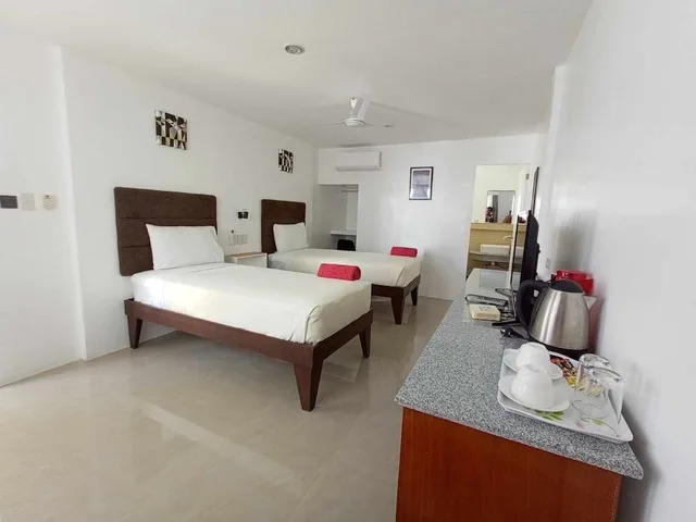 غرفة ديلوكس بسريرين منفصلين، Heartland Hotel Service Rooms And Apartments 2/3
