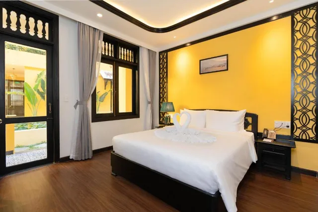 غرفة بسرير مزدوج بإطلالة على الحديقة، Lantern Boutique Hoi An 3/10