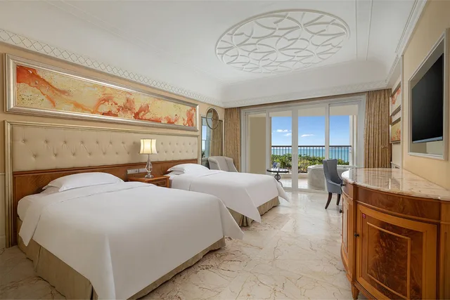 غرفة قياسية بسريرين مزدوجين بإطلالة على البحر، Crowne Plaza Resort Sanya Bay 3/3
