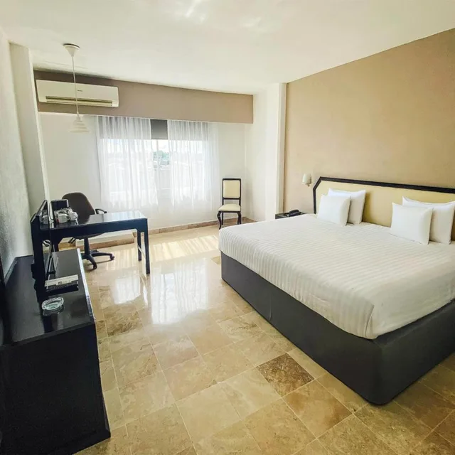 جناح جونيور بسرير كينج مع أريكة، Days Inn by Wyndham Tuxtepec 1/10