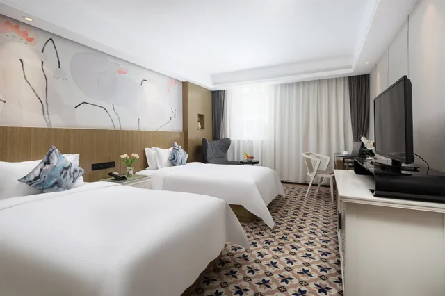 Deluxe Twin Room H، Paco Business Hotel Longkou 1/1