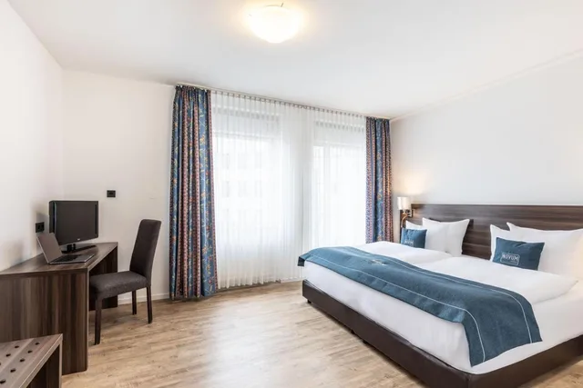 غرفة كومفورت بسرير كوين، Garner Hotel Frankfurt - Main Station 6/10