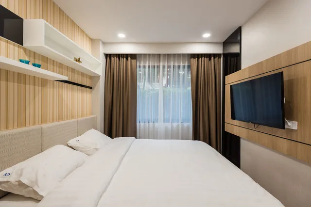 شقة ديلوكس بسرير كينج مع أريكة، Dusit Grand Park By Grandisvillas 2/3