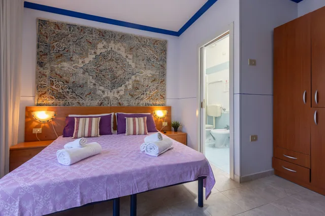 غرفة رباعية بسرير مزدوج وسرير بطابقين، Villa Vacanze Paradiso 2/5