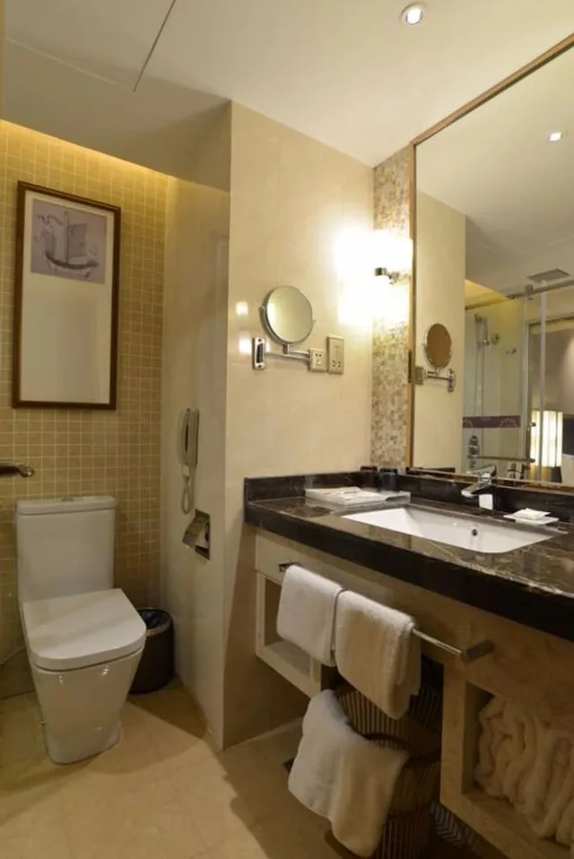 غرفة بسريرين منفصلين بإطلالة على الحديقة، Fliport Garden Hotel Fuzhou 4/4