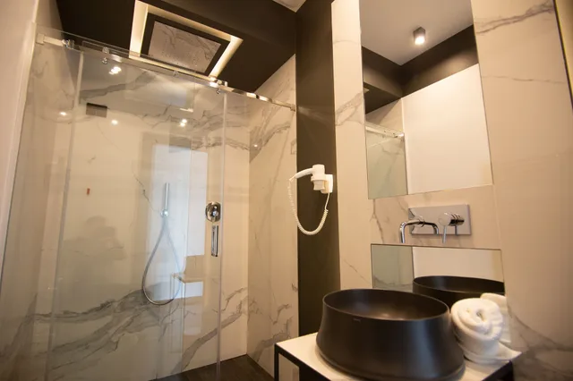 غرفة فاخرة ثلاثية بسرير كوين وسرير فردي بإطلالة على المدينة، Napoliurbansuite 5/5