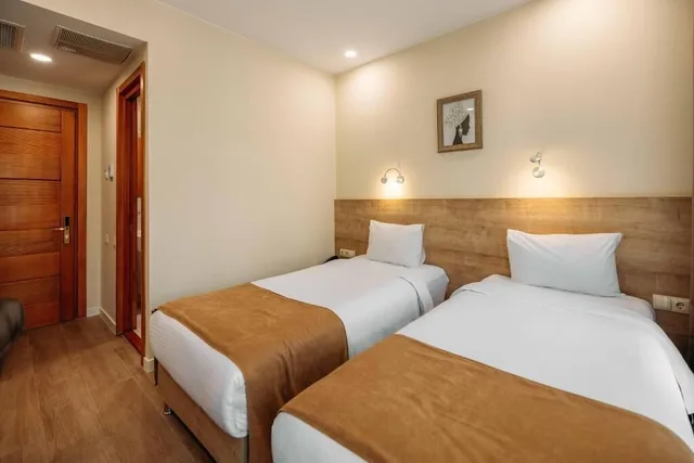 غرفة اقتصادية بسرير كينج وسريرين منفصلين بغرفة نوم واحدة، Atrium Boutique Hotel 1/3
