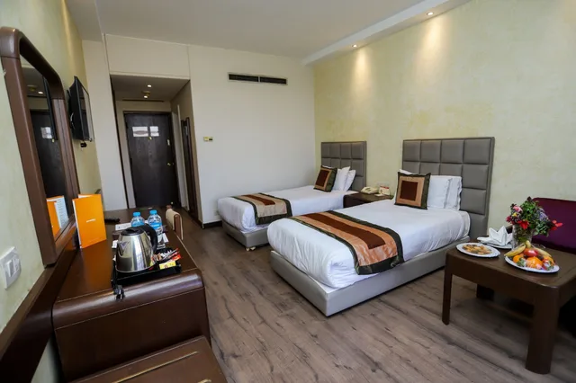 غرفة قياسية ثلاثية بسريرين منفصلين بإطلالة على الحديقة مع أريكة، Pyramisa Island Hotel Aswan 6/10