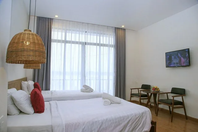 غرفة بسريرين منفصلين بشرفة، Gia Huy Riverside Hotel Hoi An 1/10