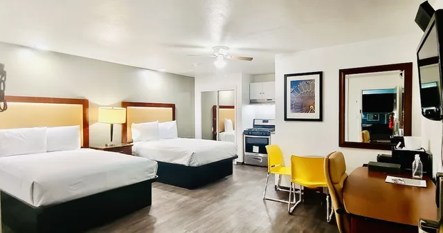 Room, 3 Double Beds, Oceanside Inn and Suites a Days Inn by Wyndham 2/5