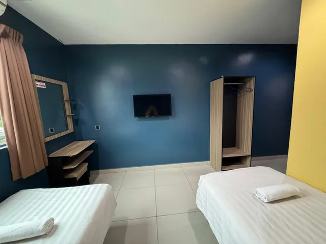 غرفة ديلوكس بسريرين منفصلين، Super OYO Capital O 804 Hotel Pinji 2/3