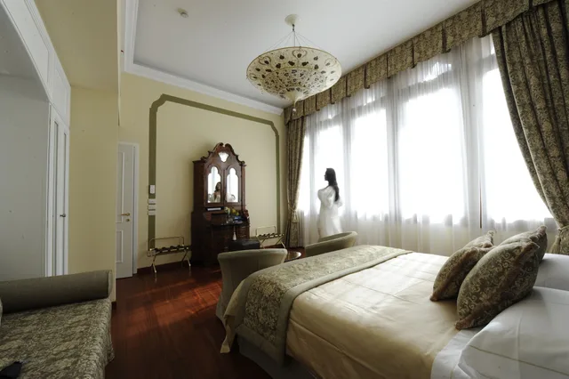 غرفة ديلوكس بسرير مزدوج وسريرين منفصلين، Hotel Le Isole 1/4
