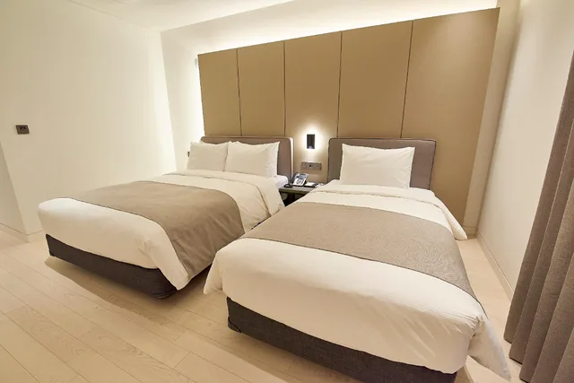 جناح عائلي تنفيذي بسرير فردي وسريرين مزدوجين، Busan City Hotel 1/1