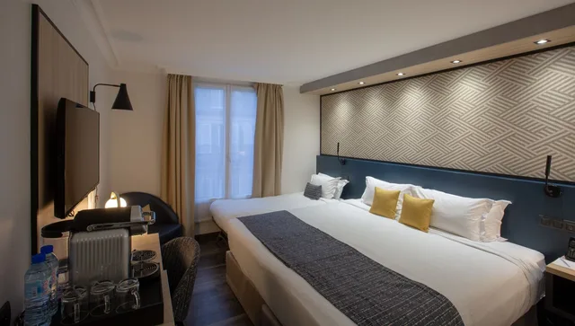 غرفة ديلوكس بسرير كينج وسرير فردي، Best Western Plus Opera Batignolles 1/10
