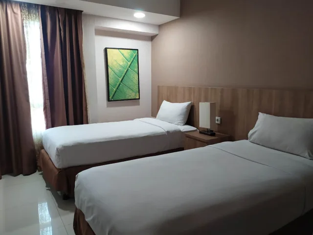 غرفة ديلوكس عائلية بغرفتي نوم، Grand Tropic Suites Jakarta 1/4