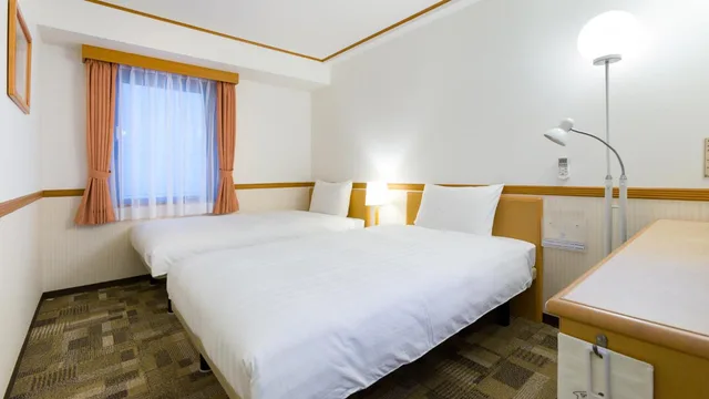 غرفة بسريرين منفصلين للمدخنين، Toyoko Inn Kagoshima Temmonkan No.2 4/5